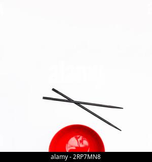 Empty red bowl chopstick isolated white background Stock Photo