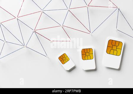 Top view three sim cards with internet communication network Stock Photo