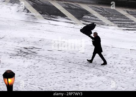 (190213) -- BEIJING, Feb. 13, 2019 -- A pedestrian walks in the snow in New York, the United States, Feb. 12, 2019. ) XINHUA PHOTOS OF THE DAY LixMuzi PUBLICATIONxNOTxINxCHN Stock Photo