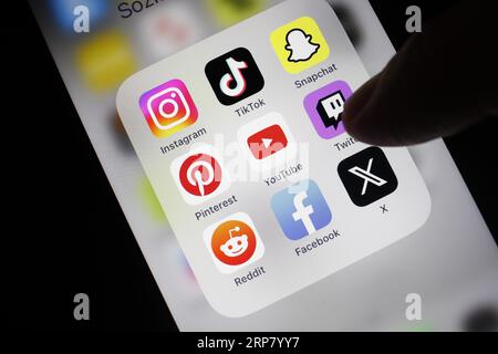 Social media icon, detailed view of a smartphone with social media apps, Facebook, Twitter, Instagram, Tik Tok, Snapchat, Pinterest, YouTube, Twitch Stock Photo