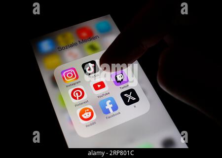 Social media icon, detailed view of a smartphone with social media apps, Facebook, Twitter, Instagram, Tik Tok, Snapchat, Pinterest, YouTube, Twitch Stock Photo