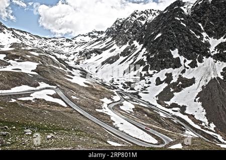 Photo with reduced dynamics saturation HDR of mountain pass alpine mountain road alpine road pass road pass Timmelsjoch Passo del Rombo Stock Photo