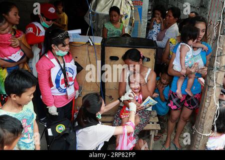 (190216) -- MANILA, Feb. 16, 2019 -- A child receives a free measles vaccine during the Philippine Red Cross Measles Outbreak Vaccination Response at a slum area in Manila, the Philippines, Feb. 16, 2019. The Philippine Department of Health (DOH) reported this week that over 4,300 measles cases were confirmed from Jan. 1 to Feb. 13, 2019, with the number expected to increase in the coming days. ) PHILIPPINES-MANILA-MEASLES VACCINATION ROUELLExUMALI PUBLICATIONxNOTxINxCHN Stock Photo