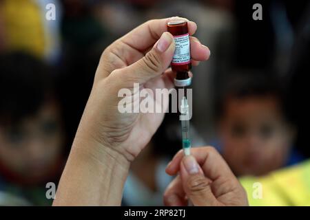 (190216) -- MANILA, Feb. 16, 2019 -- A medical worker prepares a free measles vaccine during the Philippine Red Cross Measles Outbreak Vaccination Response at a slum area in Manila, the Philippines, Feb. 16, 2019. The Philippine Department of Health (DOH) reported this week that over 4,300 measles cases were confirmed from Jan. 1 to Feb. 13, 2019, with the number expected to increase in the coming days. ) PHILIPPINES-MANILA-MEASLES VACCINATION ROUELLExUMALI PUBLICATIONxNOTxINxCHN Stock Photo