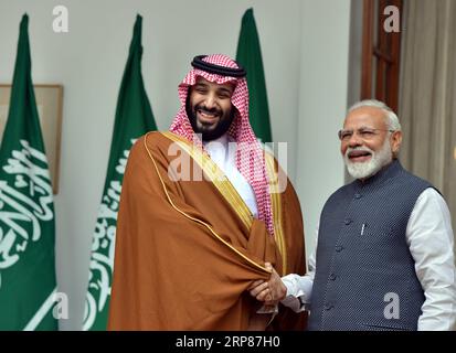 (190220) -- NEW DELHI, Feb. 20, 2019 (Xinhua) -- Visiting Saudi Crown Prince Mohammed Bin Salman Bin Abdulaziz Al-Saud (L) shakes hands with Indian Prime Minister Narendra Modi in New Delhi, India, Feb. 20, 2019. India and Saudi Arabia on Wednesday signed as many as five memorandum of understanding (MoU) in areas of infrastructure, tourism, housing, investments, and exchange of audio visual program. Besides, the two sides also signed the framework agreement on the International Solar Alliance (ISA), which is an alliance of more than 121 members. The MoUs were signed in the presence of Saudi Cr Stock Photo