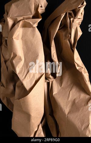 Close-up of brown crumpled packing paper shapes. Stock Photo