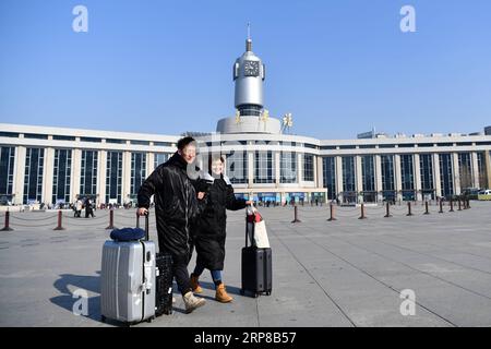 (190225) -- TIANJIN, Feb. 25, 2019 (Xinhua) -- Zhang Shiyu (R) and Lyu Xin walk outside of Tianjin Railway Station in north China s Tianjin, Feb. 1, 2019. Zhang Shiyu and Lyu Xin got married in 2018. Although the couple work in Beijing, they chose to buy their wedding house in the neighboring Tianjin City,where Zhang Shiyu was born, given the convenience brought by the Beijing-Tianjin-Hebei integration. They now go to Tianjin every two weeks and return to Beijing on Sunday nights. Thanks to the development of Beijing, Tianjin and Hebei Province -- a regional city cluster called Jing-jin-ji , t Stock Photo