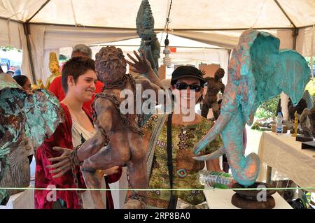 (190225) -- COLOMBO, Feb. 25, 2019 -- Visitors look at art works during Sri Lanka s open air art fair Kala Pola 2019 in Colombo, capital of Sri Lanka, Feb. 24, 2019. The event is one of Sri Lanka s largest cultural events and has attracted many tourists over the recent years. ) SRI LANKA-COLOMBO-OPEN AIR ART FAIR GayanxSameera PUBLICATIONxNOTxINxCHN Stock Photo