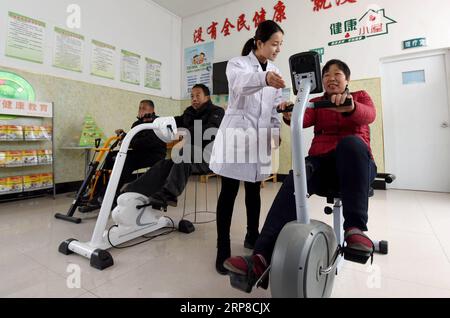 (190227) -- BEIJING, Feb. 27, 2019 (Xinhua) -- Senior villagers exercise at a health hut in Zhoulou Village of Linxi County, north China s Hebei Province, Dec. 29, 2018 The 19th National Congress of the Communist Party of China (CPC), which was convened in October 2017, for the first time proposed pursuing a rural vitalization strategy and made it clear that the development of agriculture and rural areas must be prioritized. Revitalized rural areas spring up as the implementation of rural vitalization strategy is being accelerated across the country following the principle of building rural ar Stock Photo
