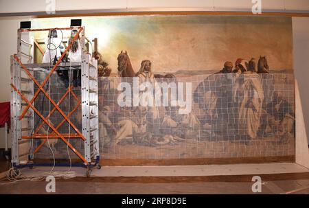 (190228) -- ISTANBUL, Feb. 28, 2019 (Xinhua) -- Staff members repair an Orientalist painting in the Painting Museum in Istanbul, Turkey, Feb. 25, 2019. The art piece, known as the largest Orientalist painting in Turkey, had been on display in the mansion in the Sariyer district for almost 140 years until the Presidency of National Palaces Administration added it lately into its collections and started an all-out restoration. TO GO WITH Feature: 154-year-old Orientalist painting under restoration at new home in Istanbul (Xinhua/Xu Suhui) TURKEY-ISTANBUL-PAINTING-RESTORATION PUBLICATIONxNOTxINxC Stock Photo