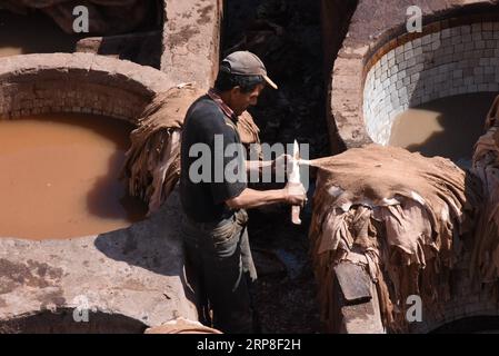 (190303) -- MOROCCO, March 3, 2019 -- A worker is seen at a tannery in the old city of Fez, Morocco, on March 2, 2019. Tanneries in the old city Fez are one of the city s most iconic sights, offering people a unique window into the natural process of producing leather goods using traditional methods. ) MOROCCO-FEZ-TANNERY Chadi PUBLICATIONxNOTxINxCHN Stock Photo