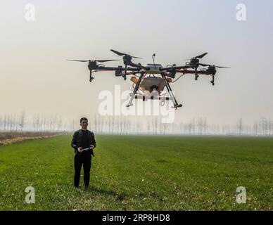 (190306) -- SUQIAN, March 6, 2019 -- A farmer operates an agricultural drone to spray pesticides in Jinsuo Township, Sihong County of Suqian, east China s Jiangsu Province, March 6, 2019. This Wednesday marks the day of Jingzhe , literally meaning the waking of insects, which is the third one of the 24 solar terms on Chinese Lunar Calendar. With the temperature rising, farmers are busy with their farm work. ) CHINA-JINGZHE-FARM WORK ZhangxLianhua PUBLICATIONxNOTxINxCHN Stock Photo