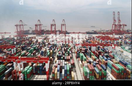 190307 -- BEIJING, March 7, 2019 Xinhua -- Photo taken on May 17, 2018 shows a container dock of Yangshan Port in Shanghai, east China. China s annual sessions of the 13th National People s Congress NPC and the 13th Chinese People s Political Consultative Conference CPPCC National Committee have opened in Beijing. Held at a critical moment in the nation s development, it is particularly important for this year s two sessions to build consensus and pool wisdom of the whole nation. Observers will be watching for the government s policy priorities at the two sessions. A new growth target will be Stock Photo