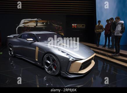 (190307) -- GENEVA, March 7, 2019 (Xinhua) -- People watch the Nissan GT-R50 concept at the 89th Geneva International Motor Show in Geneva, Switzerland, March 7, 2019. The 89th Geneva International Motor Show officially opened to the public on Thursday, where electric cars have continued to take the lead as almost a consensus by many auto makers for the future development of the industry. (Xinhua/Xu Jinquan) SWITZERLAND-GENEVA-INTERNATIONAL MOTOR SHOW PUBLICATIONxNOTxINxCHN Stock Photo