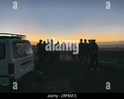 (190311) -- BEIJING, March 11, 2019 (Xinhua) -- People gather at the crash site of an Ethiopian Airlines aircraft, some 50 km east of Addis Ababa, capital of Ethiopia, on March 10, 2019. All 157 people aboard Ethiopian Airlines flight were confirmed dead as Africa s fastest growing airline witnessed the worst-ever incident in its history. The incident on Sunday, which involved a Boeing 737-800 MAX, occurred a few minutes after the aircraft took off from Addis Ababa Bole International Airport to Nairobi, Kenya. It crashed around Bishoftu town, the airline said. (Xinhua/Wang Shoubao) XINHUA PHOT Stock Photo