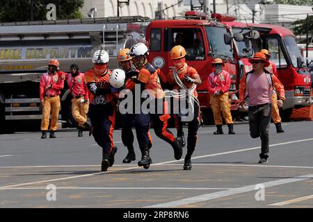 Fire Rescue Manila (190314) -- MANILA, March 14, 2019 -- Fire volunteers participate in ...