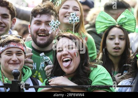 (190316) -- NEW YORK, March 16, 2019 (Xinhua) -- People watch the St. Patrick s Day Parade in New York, the United States, on March 16, 2019. Hundreds of thousands of people gathered alongside New York s Fifth Avenue to watch the St. Patrick s Day Parade here on Saturday. (Xinhua/Wang Ying) U.S.-NEW YORK-ST. PATRICK S DAY-PARADE PUBLICATIONxNOTxINxCHN Stock Photo