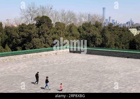 (190317) -- BEIJING, March 17, 2019 -- Photo taken with a mobile phone shows tourists walking inside the Temple of Heaven in Beijing, capital of China, March 16, 2019. ) (BeijingCandid)CHINA-BEIJING-SPRING-PARKS ZhangxHaofu PUBLICATIONxNOTxINxCHN Stock Photo