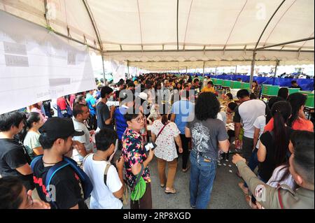 (190317) -- BANGKOK, March 17, 2019 -- People queue to vote at a polling station in Samut Prakan province, on the outskirts of Bangkok, Thailand, March 17, 2019. An average of 75 percent voter turnout was reported in Sunday s early voting for the general election in Thailand, a senior official of the Election Commission said. ) THAILAND-BANGKOK-GENERAL ELECTION-EARLY VOTING RachenxSageamsak PUBLICATIONxNOTxINxCHN Stock Photo