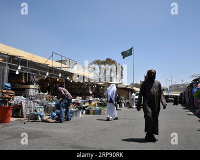 (190319) -- ABHA (SAUDI ARABIA), March 19, 2019 (Xinhua) -- Photo taken on March 19, 2019 shows a view of the Thulatha Market in Abha, Asir Province, Saudi Arabia. Thulatha, a famous traditional market in the city of Abha, sells fresh produce and local handicrafts, such as honey, dates, gold and silver Bedouin jewelry, women s embroidered dresses, and locally-made daggers. The Thulatha Market used to only operate on Tuesdays, and now is open seven days a week, attracting lots of shoppers and visitors. (Xinhua/Tu Yifan) SAUDI ARABIA-ABHA-MARKET PUBLICATIONxNOTxINxCHN Stock Photo