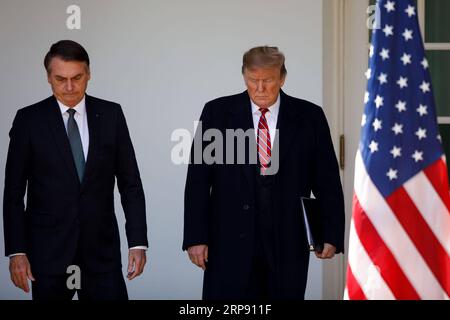 (190320) -- WASHINGTON D.C., March 20, 2019 (Xinhua) -- U.S. President Donald Trump (R) attends a joint press conference with his Brazilian counterpart Jair Bolsonaro at the Rose Garden of the White House in Washington D.C., the United States, on March 19, 2019. U.S. President Donald Trump on Tuesday indicated that he may support Brazil to join the North Atlantic Treaty Organization (NATO) and the Organization for Economic Co-operation and Development (OECD), as the two nations expected to further their economic cooperation. (Xinhua/Ting Shen) U.S.-WASHINGTON D.C.-TRUMP-BRAZIL-PRESIDENT-PRESS Stock Photo