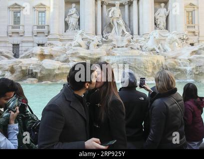 (190321) -- BEIJING, March 21, 2019 (Xinhua) -- A young couple kisses in front of the Trevi Fountain in Rome, capital of Italy, March 19, 2019. (Xinhua/Lan Hongguang) XINHUA PHOTOS OF THE DAY PUBLICATIONxNOTxINxCHN Stock Photo