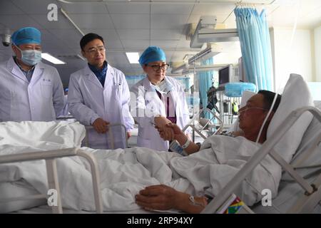 (190324) -- XIANGSHUI, March 24, 2019 (Xinhua) -- Sun Qingfang (2nd R), chief physician of neurosurgery of Ruijin Hospital affiliated with Shanghai Jiaotong University School of Medicine, and other doctors check an injured man of a factory explosion at the intensive care unit in the First People s Hospital of Yancheng in Yancheng, east China s Jiangsu Province, March 23, 2019. The explosion happened at about 2:48 p.m. Thursday following a fire that broke out in a plant owned by Jiangsu Tianjiayi Chemical Co. Ltd., in a chemical industrial park in Xiangshui County in the city of Yancheng. Thous Stock Photo