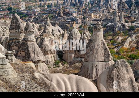 Rock formations 'Fairy Chimneys' in the town of Göreme, Cappadocia, Turkey Stock Photo