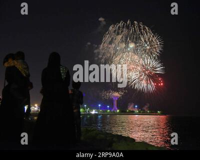 (190330) -- KHOBAR, March 30, 2019 (Xinhua) -- Visitors take pictures of fireworks during the Sharqiah Season by the Al-Khobar corniche in Eastern Province of Saudi Arabia, March 29, 2019. The Sharqiah Season, held in nine cities in Eastern Province, wrapped up on March 30. Over the period of 17 days, the season entailed a carefully crafted selection of over 100 programs and activities covering culture, sports, education and entertainment. (Xinhua/Tu Yifan) SAUDI ARABIA-EASTERN PROVINCE-SHARQIAH SEASON PUBLICATIONxNOTxINxCHN Stock Photo