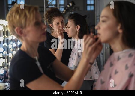 (190331) -- MOSCOW, March 31, 2019 -- Models prepare for the opening ceremony of the Fashion Week Russia in Moscow, Russia, March 30, 2019. The fashion week would last from March 30 to April 3. Evgeny Sinitsyn) RUSSIA-MOSCOW-FASHION SHOW lujinbo PUBLICATIONxNOTxINxCHN Stock Photo