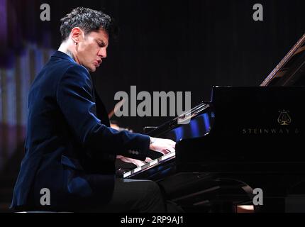 (190331) -- ZAGREB, March 31, 2019 -- Croatian pianist Maksim Mrvica performs during a concert in the Vatroslav Lisinski Concert Hall in Zagreb, Croatia, March 30, 2019. ) CROATIA-ZAGREB-MUSIC-MAKSIM MRVICA MarkoxLukunic PUBLICATIONxNOTxINxCHN Stock Photo