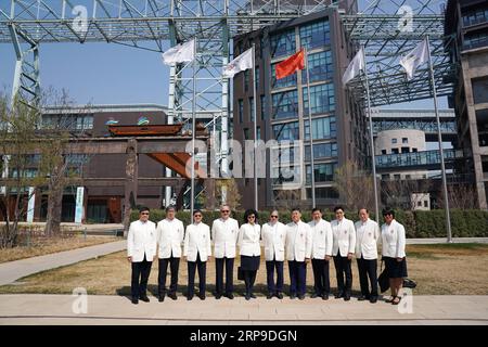 (190403) -- BEIJING, April 3, 2019 (Xinhua) -- Members of the delegation of Sports Federation and Olympic Committee of Hong Kong, China, pose for photos at the flag-raising square of the Beijing Organizing Committee for the 2022 Olympic and Paralympic Winter Games in the Shougang Park in Shijingshan District in Beijing, capital of China, April 3, 2019. (Xinhua/Ju Huanzong) (SP)CHINA-BEIJING-TIMOTHY FOK TSUN-TING-VISIT(CN) PUBLICATIONxNOTxINxCHN Stock Photo