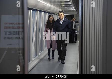 (190409) -- VANTAA, April 9, 2019 (Xinhua) -- Bai Weishan, general manager of Tibet Airlines (R), arrives at Helsinki-Vantaa Airport aboard Tibet Airlines inaugural flight from Jinan, China, on April 8, 2019. An Airbus 330 operated by China Tibet Airlines landed at the Helsinki-Vantaa International Airport late on Monday, opening the weekly direct flights between Jinan, Shandong Province of China and Helsinki, capital of Finland. Tibet Airlines has one flight to Finland every week in April and will possibly run two weekly flights in June. (Xinhua/Matti Matikainen) FINLAND-VANTAA-TIBET AIRLINES Stock Photo