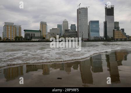 (190415) -- LONDON, April 15, 2019 (Xinhua) -- Photo taken on April 12, 2019 shows a general view of Canary Wharf in London, Britain. The deal agreed between UK Prime Minister Theresa May and the European Union (EU) to extend the Brexit date until the end of October will delay any rebound in economic performance, an economist said in a recent interview with Xinhua. May s agreement in Brussels with leaders of the EU to move the Brexit date from April 12 to Oct. 31 will have economic and monetary policy consequences, according to Paul Dales, chief UK economist at Capital Economics, an economic a Stock Photo