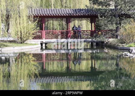 (190418) -- BERLIN, April 18, 2019 (Xinhua) -- Visitors are seen at the Deyue Chinese Garden of the Gardens of the World in eastern Berlin, Germany, on April 17, 2019. The Deyue Chinese Garden inside the Gardens of the World was first built in 1997 and opened to the public in 2000. (Xinhua/Shan Yuqi) GERMANY-BERLIN-GARDENS OF THE WORLD-CHINESE GARDEN PUBLICATIONxNOTxINxCHN Stock Photo
