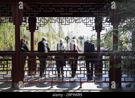 (190418) -- BERLIN, April 18, 2019 (Xinhua) -- Visitors are seen at the Deyue Chinese Garden of the Gardens of the World in eastern Berlin, Germany, on April 17, 2019. The Deyue Chinese Garden inside the Gardens of the World was first built in 1997 and opened to the public in 2000. (Xinhua/Shan Yuqi) GERMANY-BERLIN-GARDENS OF THE WORLD-CHINESE GARDEN PUBLICATIONxNOTxINxCHN Stock Photo