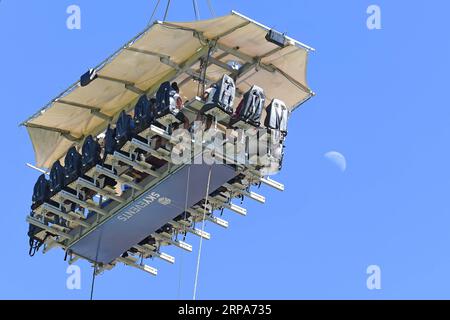 (190427) -- JOHANNESBURG, April 27, 2019 (Xinhua) -- Guests have meals at the Sky Table in Johannesburg, South Africa, April 27, 2019. The Sky Table, capable of accommodating 22 guests, is on a platform suspended at a height of 50 meters in St Stithians College. (Xinhua/Chen Cheng) SOUTH AFRICA-JOHANNESBURG-SKY RESTAURANT PUBLICATIONxNOTxINxCHN Stock Photo