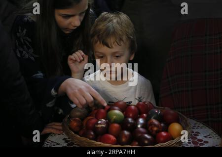 (190428) -- BELGRADE, April 28, 2019 -- Children choose Easter eggs during an Easter mass in Saint Sava Temple in Belgrade, Serbia, April 28, 2019. Orthodox Serbs observe Easter according to the old Julian calendar, and it falls on April 28 this year. ) SERBIA-BELGRADE-EASTER MASS PredragxMilosavljevic PUBLICATIONxNOTxINxCHN