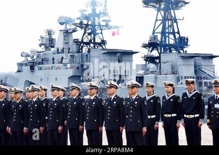 (190429) -- QINGDAO, April 29, 2019 (Xinhua) -- Soldiers of the Chinese People s Liberation Army (PLA) Navy stand at Dagang port to welcome Russian cruiser Varyag in Qingdao, east China s Shandong Province, April 29, 2019. Russian naval vessels arrived in Qingdao on Monday to participate in the Sino-Russian Joint Sea-2019 exercise. The exercise will focus on joint sea defense, which aims to consolidate and develop the China-Russia comprehensive strategic partnership of coordination, deepen pragmatic naval cooperation, and improve their capabilities to jointly respond to security threats at sea Stock Photo