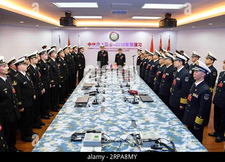 (190429) -- QINGDAO, April 29, 2019 (Xinhua) -- Qiu Yanpeng (C, R), chief director of Joint Sea-2019 exercise from the Chinese side and deputy commander of the Chinese People s Liberation Army (PLA) Navy, declares the opening of the Sino-Russian Joint Sea-2019 exercise in Qingdao, east China s Shandong Province, April 29, 2019. Russian naval vessels arrived in Qingdao on Monday to participate in the Sino-Russian Joint Sea-2019 exercise. The exercise will focus on joint sea defense, which aims to consolidate and develop the China-Russia comprehensive strategic partnership of coordination, deepe Stock Photo