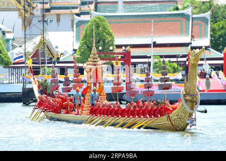 (190430) -- BANGKOK, April 30, 2019 -- Royal Thai Navy oarsmen row the Suphannahong Royal Barge past the Grand Palace during a rehearsal of Thai King Maha Vajiralongkorn s coronation ceremonies on the Chao Phraya River in Bangkok, Thailand, April 30, 2019. Thailand has decided against inviting any foreign leaders to the coronation ceremonies of King Maha Vajiralongkorn, scheduled for the upcoming weekend, according to a press statement of the Ministry of Foreign Affairs issued on Tuesday. ) THAILAND-BANGKOK-KING-CORONATION-REHEARSAL RachenxSageamsak PUBLICATIONxNOTxINxCHN Stock Photo