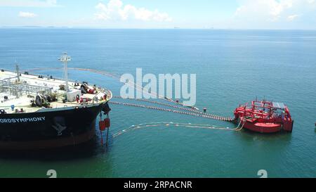 (190504) -- BANDAR SERI BEGAWAN, May 4, 2019 (Xinhua) -- Aerial view of unloading operation of the first crude oil shipment to Hengyi Industries oil refinery and petrochemical plant at Pulau Muara Besar (PMB) in Bandar Seri Begawan, capital of Brunei, May 3, 2019. After the successful unloading of the first crude oil shipment on Thursday night, the oil refinery and petrochemical plant at Pulau Muara Besar (PMB), the biggest joint venture between China and Brunei, officially enters the stage of trial operation and production, Chen Liancai, CEO of Hengyi Industries said on Friday. (Xinhua/Hengyi Stock Photo