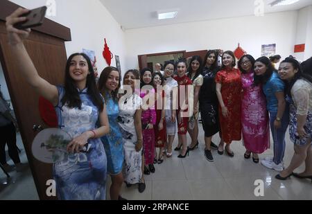 (190515) -- BEIRUT, May 15, 2019 -- Students and teachers wearing traditional Chinese women s dress Qipao pose for photos during the Chinese Cultural Day event in Beirut, Lebanon, on May 15, 2019. About 50 students took part in the Chinese Cultural Day event, which was organized by the Center for Languages and Translation at the Lebanese University on Wednesday to celebrate the end of their academic year. ) LEBANON-BEIRUT-CHINESE CULTURAL DAY BilalxJawich PUBLICATIONxNOTxINxCHN Stock Photo