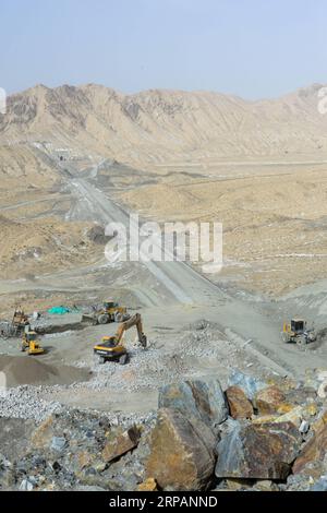 (190516) -- RUOQIANG, May 16, 2019 (Xinhua) -- Photo taken on May 15, 2019 shows the construction site of Golmud-Korla Railway in Ruoqiang County, northwest China s Xinjiang Uygur Autonomous Region. The 13.195-kilometer-long tunnel through Altun Mountains is the longest tunnel of the Golmud-Korla railway line. The railway line, connecting Golmud in Qinghai and Korla in Xinjiang, is the third rail artery linking Xinjiang with neighboring provinces. The line will cut the traffic time between Golmud and Korla from 26 hours to 12 hours. (Xinhua/Ding Lei) CHINA-XINJIANG-RAILWAY-TUNNEL-CONSTRUCTION Stock Photo