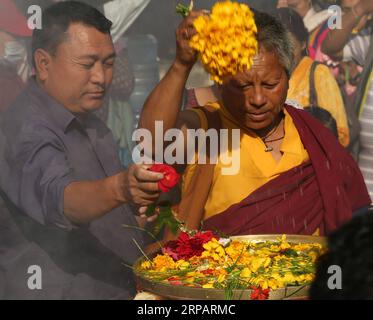 (190518) -- KATHMANDU, May 18, 2019 -- People offer prayers during the celebration of Buddha Jayanti Festival at Swayambhunath in Kathmandu, capital of Nepal, on May 18, 2019. The Buddha Jayanti festival is celebrated as a holy day by Buddhists in many Asian countries to mark the birth, enlightenment and Nirvana of Gautam Buddha. ) NEPAL-KATHMANDU-BUDDHA JAYANTI FESTIVAL SunilxSharma PUBLICATIONxNOTxINxCHN Stock Photo