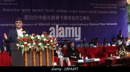 (190521) -- DHADING, May 21, 2019 -- Nepali Prime Minister KP Sharma Oli (L) speaks in a ground breaking ceremony of laying the optical fibers at Galchhi Rural Municipality of Dhading District, in Western Kathmandu, May 20, 2019. China Communications Services International Limited started to lay optical fibers along a highway connecting the eastern and western border of Nepal for Nepal Telecom (NT), one of the biggest telecom service providers of Nepal. The Chinese company is responsible for laying 555 kilometers of optical fibers out of the planned 2,179-km long fibers from Chiyabhanjyang in Stock Photo