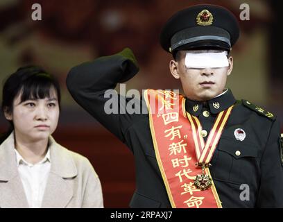 (190521) -- BEIJING, May 21, 2019 (Xinhua) -- Soldier Du Fuguo salutes during an awarding ceremony in Beijing, capital of China, Jan. 23, 2019. As a mine sweeper, Du Fuguo lost his eyes and hands during mine clearance on Oct. 11, 2018. (Xinhua/Zhang Yongjin) XINHUA PHOTOS OF THE DAY PUBLICATIONxNOTxINxCHN Stock Photo