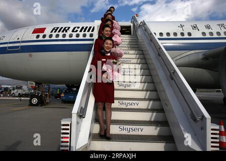 (190521) -- BEIJING, May 21, 2019 -- Flight attendants of Air China holding bouquets pose for photos after the flight lands at Athens International Airport in Athens, Greece, Sept. 30, 2017. ) Xinhua Headlines: Milestone deal on civil aviation to enhance China-EU cooperation MariosxLolos PUBLICATIONxNOTxINxCHN Stock Photo