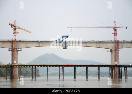(190521) -- LAOS, May 21, 2019 (Xinhua) -- Photo taken on May 21, 2019 shows the Luang Prabang cross-Mekong River railway bridge in northern Laos. The first bridge span of the China-Laos railway has been built over the Mekong River in northern Laos, the Laos-China Railway Co., Ltd., which is in charge of the construction and operation of the railway said on Tuesday. Accordingly, the China Railway No. 8 Engineering Group (CREC-8) has completed the closure of the first span of the Luang Prabang cross-Mekong River railway bridge on Saturday. It is also the first completed bridge span of two cross Stock Photo