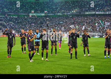 Team FCB celebrate with fans: Dayot Upamecano , FCB 2 Joshua KIMMICH, FCB 6  Thomas MUELLER, MÜLLER, FCB 25 Eric MAXIM CHOUPO-MOTING (FCB 13) MinJae Kim, Min-Jae Kim , FCB 3 Leon GORETZKA, FCB 8 Kingsley Coman, FCB 11  Harry Kane, FCB 9   in the match BORUSSIA MOENCHENGLADBACH - FC BAYERN MUENCHEN 1-2  on Sept 2, 2023 in Mönchengladbach, Germany. Season 2023/2024, 1.Bundesliga, FCB, MG, Gladbach, matchday 3, 3.Spieltag © Peter Schatz / Alamy Live News    - DFL REGULATIONS PROHIBIT ANY USE OF PHOTOGRAPHS as IMAGE SEQUENCES and/or QUASI-VIDEO - Stock Photo